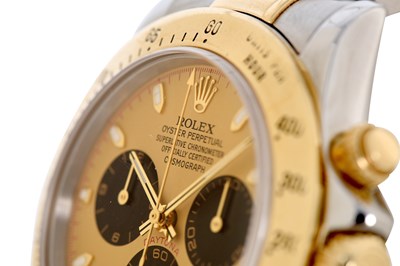 Lot 6 - AN ELEGANT MEN’S ROLEX STAINLESS STEEL AND 18K GOLD AUTOMATIC CHRONOGRAPH BRACELET WATCH.