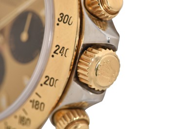 Lot 6 - AN ELEGANT MEN’S ROLEX STAINLESS STEEL AND 18K GOLD AUTOMATIC CHRONOGRAPH BRACELET WATCH.