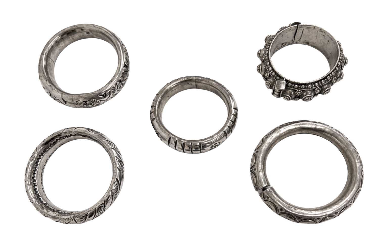 Lot 67 - A COLLECTION OF RIGID INDIAN SILVER BRACELETS AND BANGLES (FIVE)