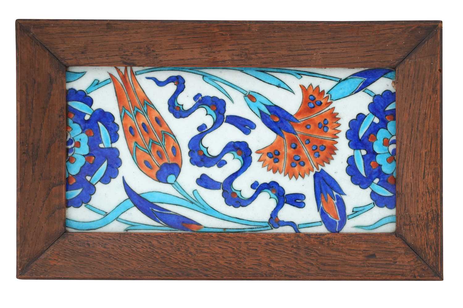 Lot 22 - AN IZNIK-STYLE POTTERY BORDER TILE