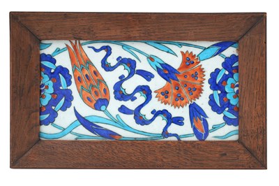 Lot 22 - AN IZNIK-STYLE POTTERY BORDER TILE