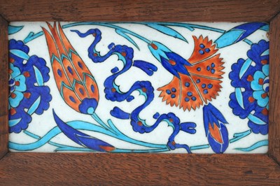 Lot 22 - AN IZNIK-STYLE POTTERY BORDER TILE