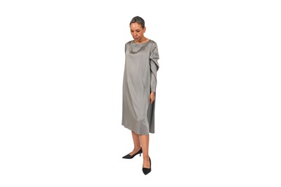 Lot 91 - A DRIES VAN NOTEN SILVER-GREY SATIN DRAPED DRESS