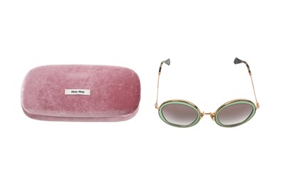 Lot 184 - MIU MIU OVERSIZED ROUND SUNGLASSES IN GREEN ACETATE AND GOLD-TONE METAL, WITH ORIGINAL CASE