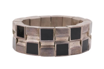 Lot 223 - MEXICAN MODERNIST STERLING SILVER AND BLACK STONE ARTICULATED BRACELET