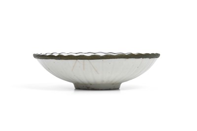Lot 6 - A CHINESE LOBED DING WARE BOWL