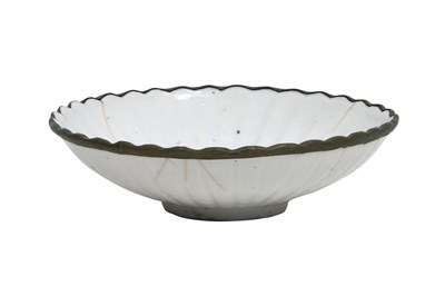 Lot 6 - A CHINESE LOBED DING WARE BOWL