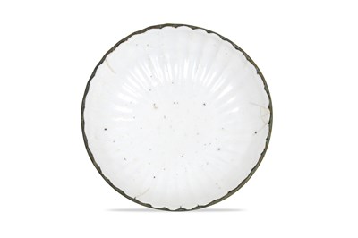 Lot 6 - A CHINESE LOBED DING WARE BOWL
