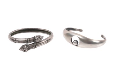 Lot 221 - A DUO OF SILVER BANGLES, COMPRISING A SIGNED CUFF AND A TORC-STYLE EXAMPLE (TWO)