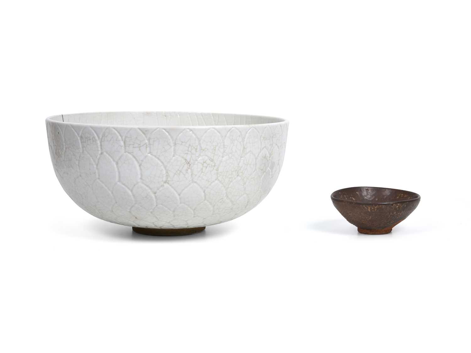 Lot 14 - A CHINESE WHITE-GLAZED ‘LOTUS’ BOWL AND A BROWN-GLAZED BOWL