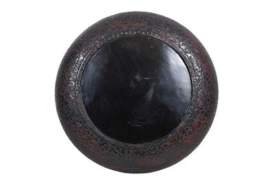 Lot 10 - A JAPANESE NEGORO LACQUER 'LION DOG' DISH