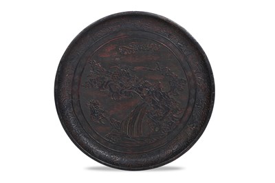 Lot 10 - A JAPANESE NEGORO LACQUER 'LION DOG' DISH