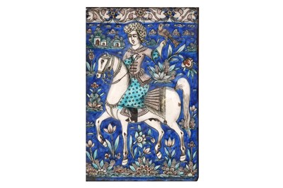 Lot 20 - A QAJAR POTTERY TILE OF A FALCONER ON HORSEBACK