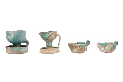 Lot 6 - A COLLECTION OF FOUR PERSIAN SELJUK GLAZED POTTERY OIL LAMPS
