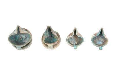 Lot 6 - A COLLECTION OF FOUR PERSIAN SELJUK GLAZED POTTERY OIL LAMPS
