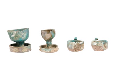 Lot 6 - A COLLECTION OF FOUR PERSIAN SELJUK GLAZED POTTERY OIL LAMPS