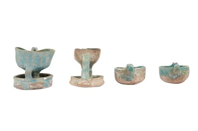 Lot 6 - A COLLECTION OF FOUR PERSIAN SELJUK GLAZED POTTERY OIL LAMPS
