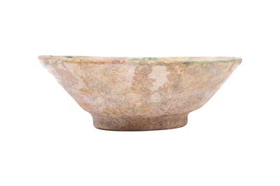 Lot 1 - A ABBASID POTTERY BOWL WITH STYLISED KUFIC CALLIGRAPHY