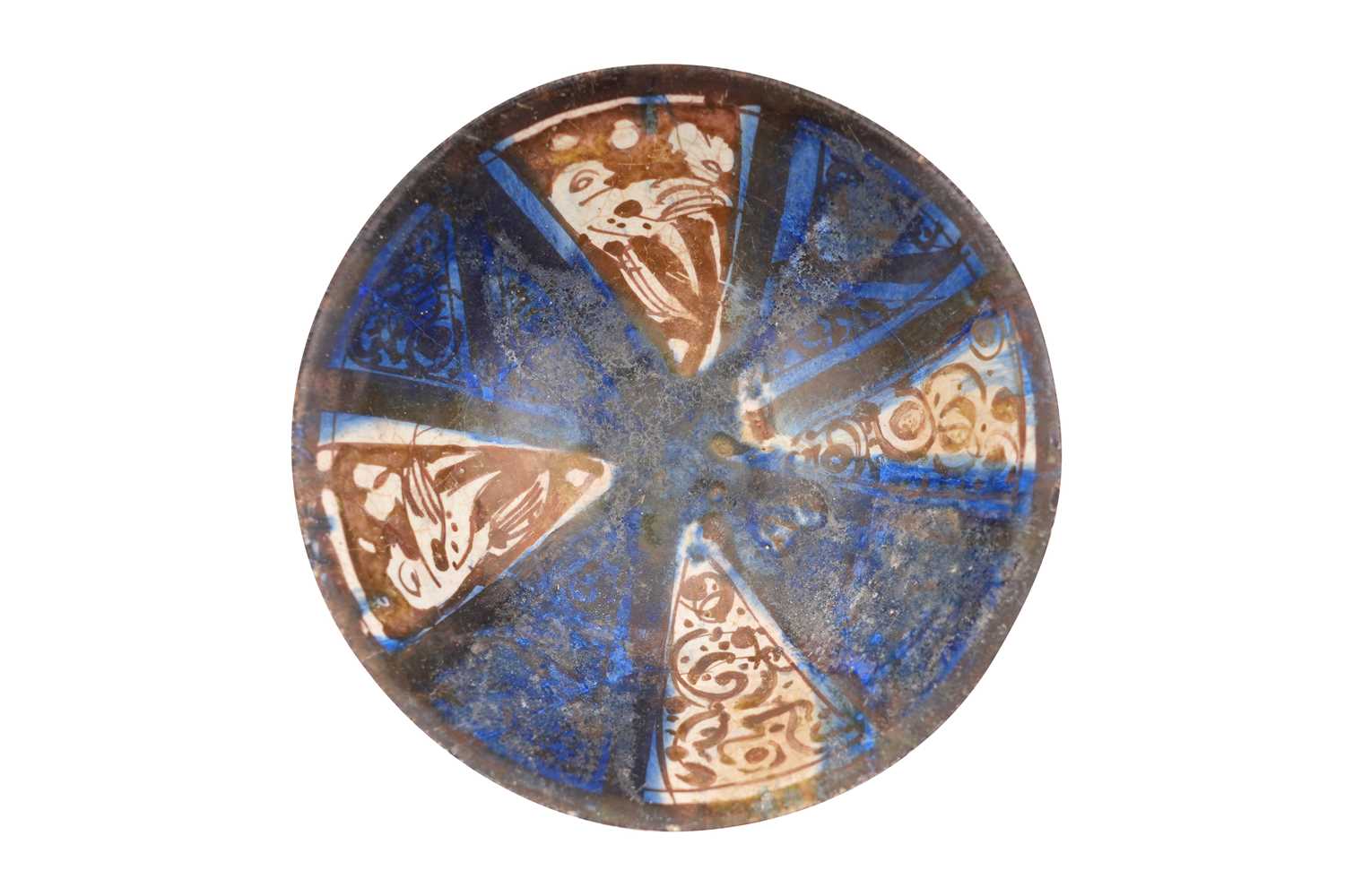 Lot 10 - A KASHAN COPPER LUSTRE AND COBALT-BLUE GLAZED POTTERY BOWL