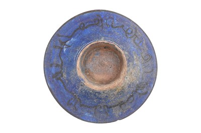Lot 10 - A KASHAN COPPER LUSTRE AND COBALT-BLUE GLAZED POTTERY BOWL