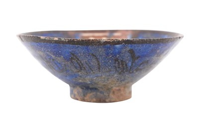 Lot 10 - A KASHAN COPPER LUSTRE AND COBALT-BLUE GLAZED POTTERY BOWL