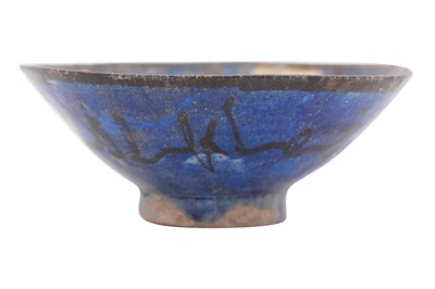 Lot 10 - A KASHAN COPPER LUSTRE AND COBALT-BLUE GLAZED POTTERY BOWL