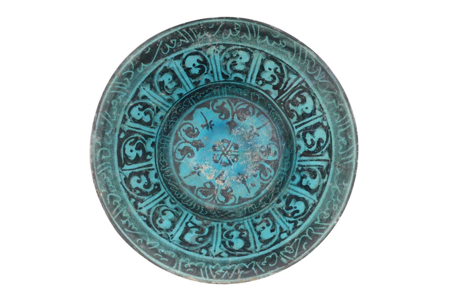Lot 7 - A LARGE KASHAN SILHOUETTE-WARE TURQUOISE GLAZED POTTERY BOWL