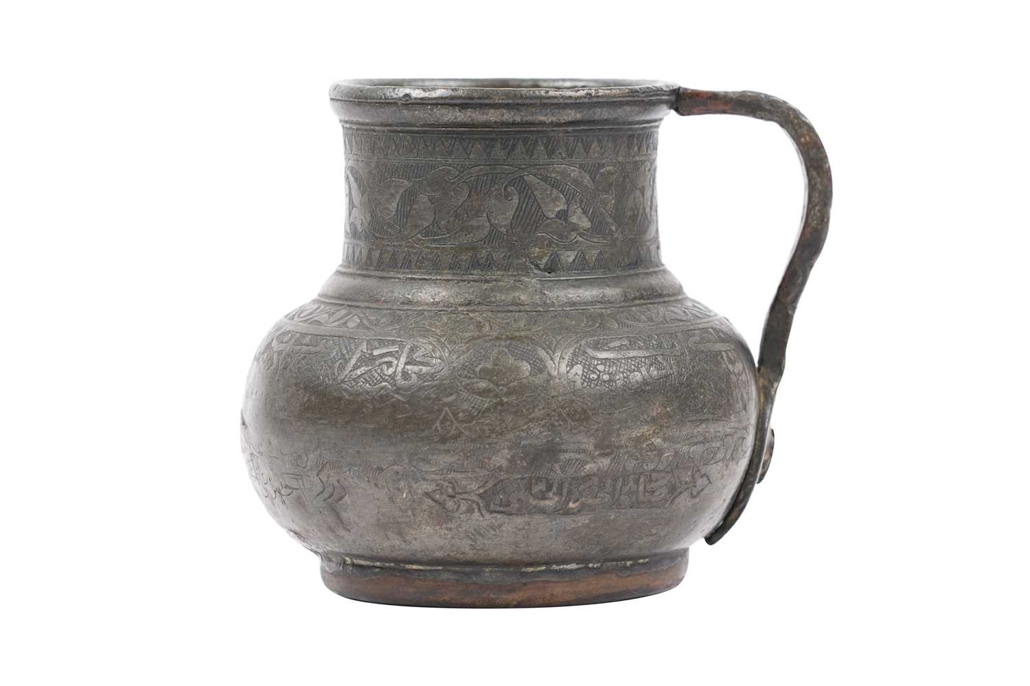 Lot 36 - A TIMURID ENGRAVED TINNED COPPER JUG (MASHRABE)