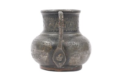 Lot 36 - A TIMURID ENGRAVED TINNED COPPER JUG (MASHRABE)