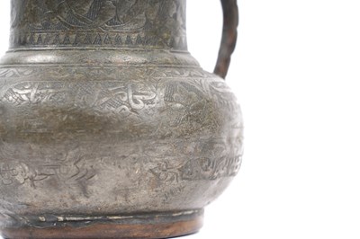Lot 36 - A TIMURID ENGRAVED TINNED COPPER JUG (MASHRABE)