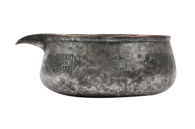 Lot 35 - A MAMLUK ENGRAVED TINNED COPPER POURING VESSEL
