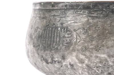 Lot 35 - A MAMLUK ENGRAVED TINNED COPPER POURING VESSEL