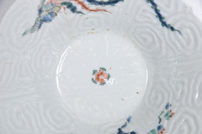 Lot 20 - A JAPANESE MOULDED KAKIEMON 'PHOENIX' BOWL