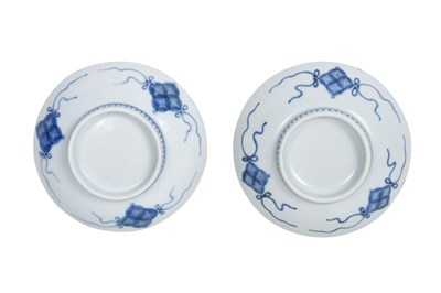 Lot 24 - A JAPANESE BLUE AND WHITE NABESHIMA ‘WISTERIA’ DISH AND TWO NABESHIMA ‘WILD ORCHID’ SAUCERS