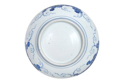 Lot 24 - A JAPANESE BLUE AND WHITE NABESHIMA ‘WISTERIA’ DISH AND TWO NABESHIMA ‘WILD ORCHID’ SAUCERS