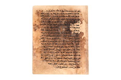 Lot 64 - A KUFIC QUR'AN LEAF