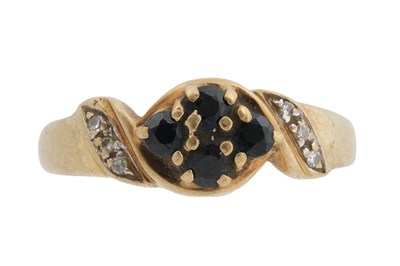 Lot 47 - A 9CT GOLD BLACK STONE AND DIAMOND RING