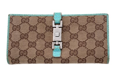 Lot 140 - A GUCCI 'GG' CANVAS AND TURQUOISE LEATHER JACKIE CLASP WALLET