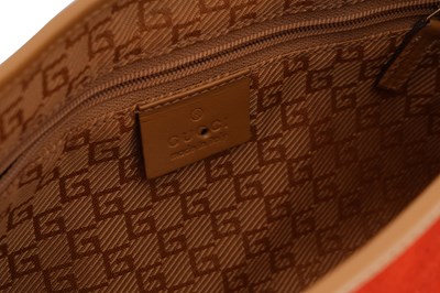 Lot 128 - A GUCCI ‘JACKIE’ BURNT ORANGE SUEDE AND TAN LEATHER SHOULDER BAG
