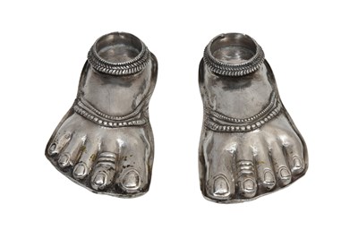 Lot 66 - A PAIR OF REPOUSSÉ SILVER SHEET MINIATURE DEITY'S FEET