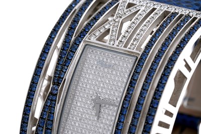 Lot 8 - A CHOPARD 'MONTRE DAME XL' 18CT WHITE GOLD, SAPPHIRE AND DIAMOND LADIES WRISTWATCH