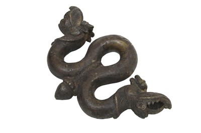 Lot 24 - AN INDIAN BRONZE DOORKNOCKER WITH MAKARA HEADS