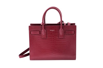 Lot 117 - A SAINT LAURENT BABY ’SAC DE JOUR' BURGUNDY CROCODILE-EMBOSSED LEATHER BAG