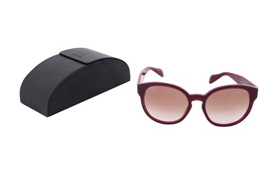 Lot 147 - A PAIR OF PRADA BURGUNDY ACETATE SUNGLASSES