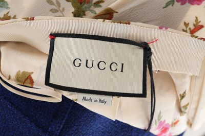 Lot 76 - A GUCCI FLORAL SILK PLEATED SKIRT WITH TAGS