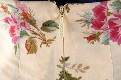 Lot 76 - A GUCCI FLORAL SILK PLEATED SKIRT WITH TAGS