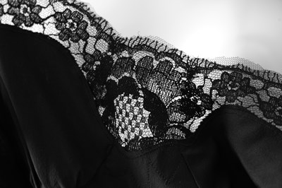 Lot 96 - A DOLCE & GABBANA BLACK POLKA DOT SILK CHIFFON DRESS