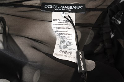 Lot 96 - A DOLCE & GABBANA BLACK POLKA DOT SILK CHIFFON DRESS