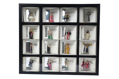 Lot 170 - A COLLECTION OF 16 PIXI 'MODE: LA HAUTE COUTURE' MINIATURE FASHION DESIGNER FIGURINES IN DISPLAY BOX