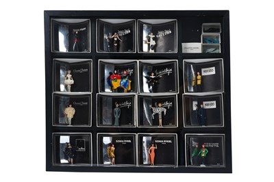 Lot 171 - A COLLECTION OF 18 PIXI 'MODE: LA HAUTE COUTURE' MINIATURE FASHION DESIGNER FIGURINES IN DISPLAY BOX
